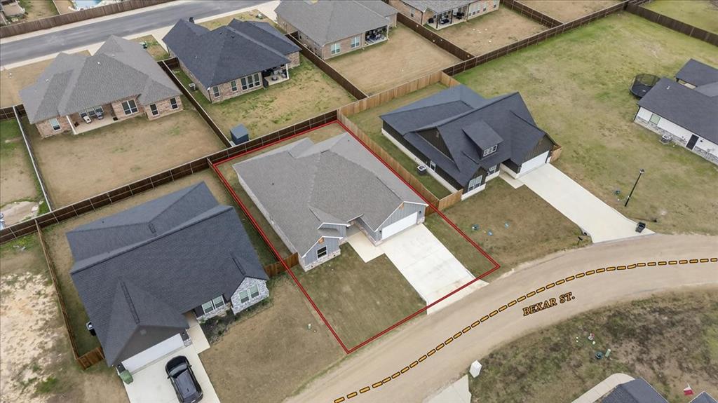 117 East Bexar Street Mabank, TX 75147 - Photo 22 of 27 an aerial view of residential house with parking