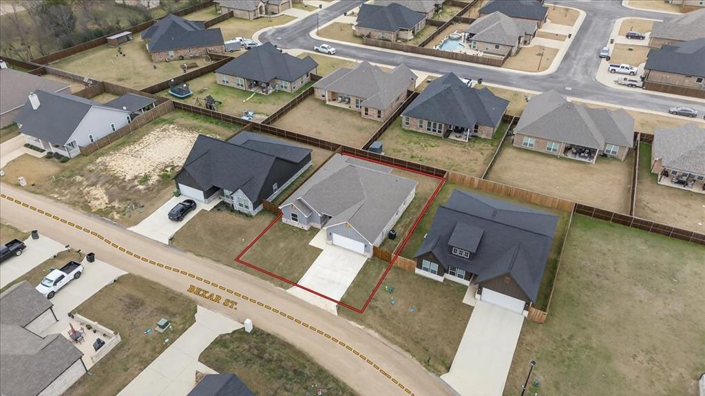 117 East Bexar Street Mabank, TX 75147 - Photo 23 of 27 an aerial view of a house with a yard