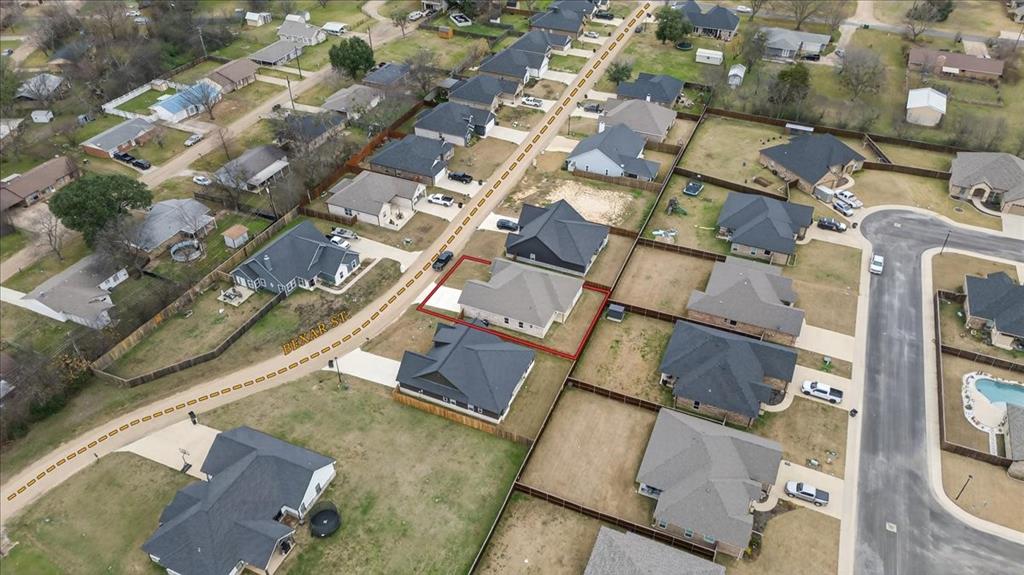117 East Bexar Street Mabank, TX 75147 - Photo 24 of 27 an aerial view of residential building with parking