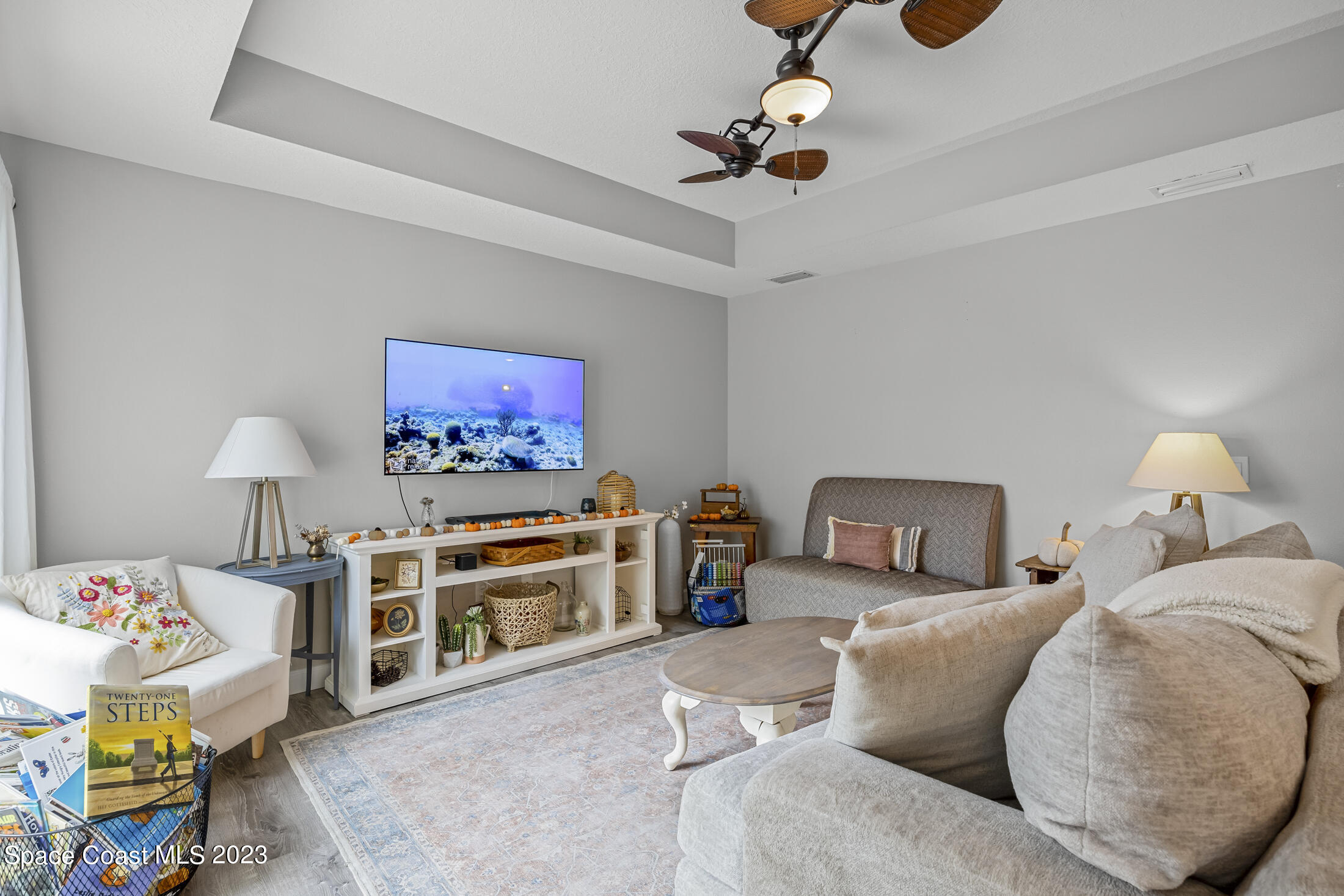 1003 Hayden Road Rockledge, FL 32955 - Photo 13 of 29 a bed room with a bed and a lamp
