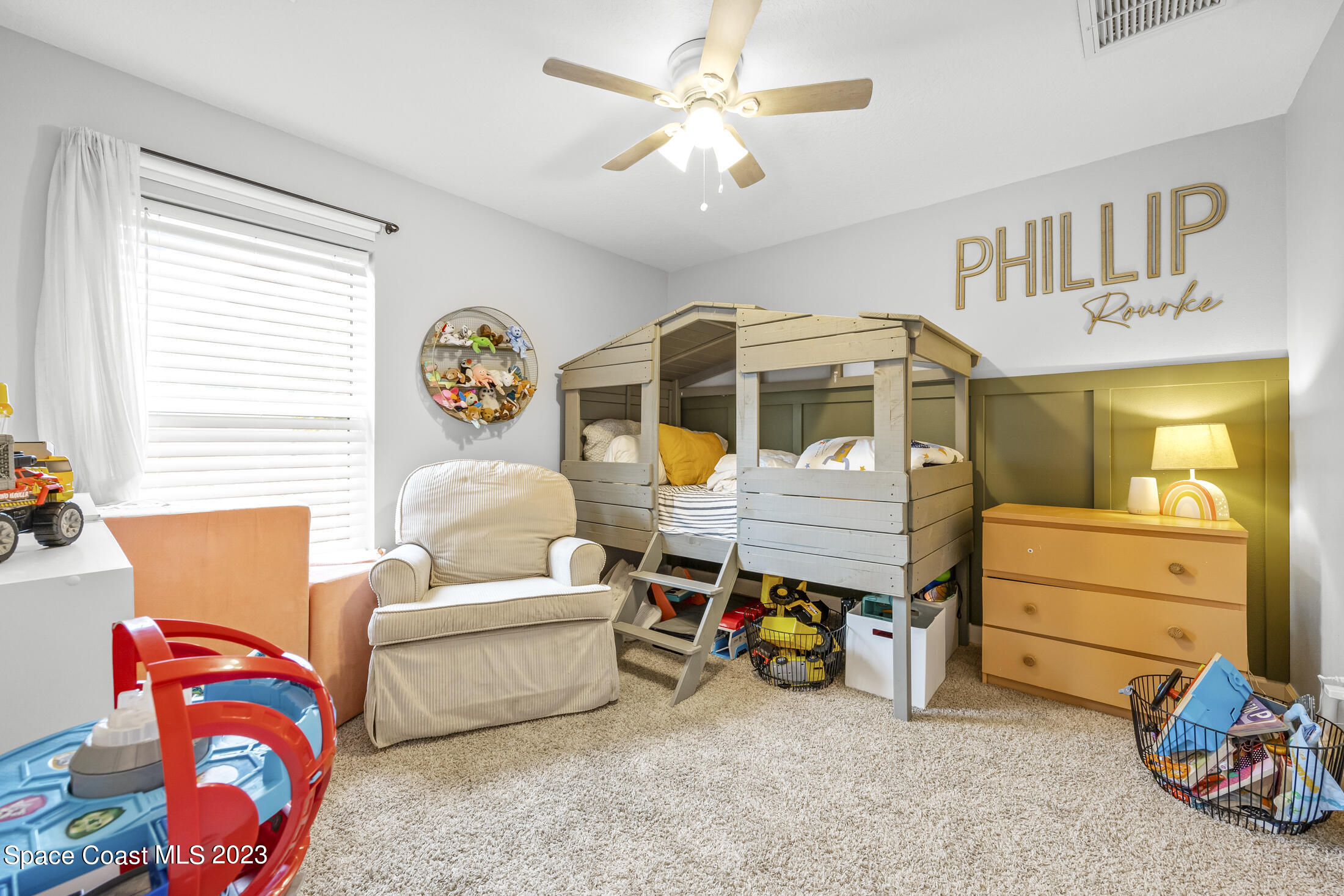 1003 Hayden Road Rockledge, FL 32955 - Photo 20 of 29 a bedroom with furniture and a window