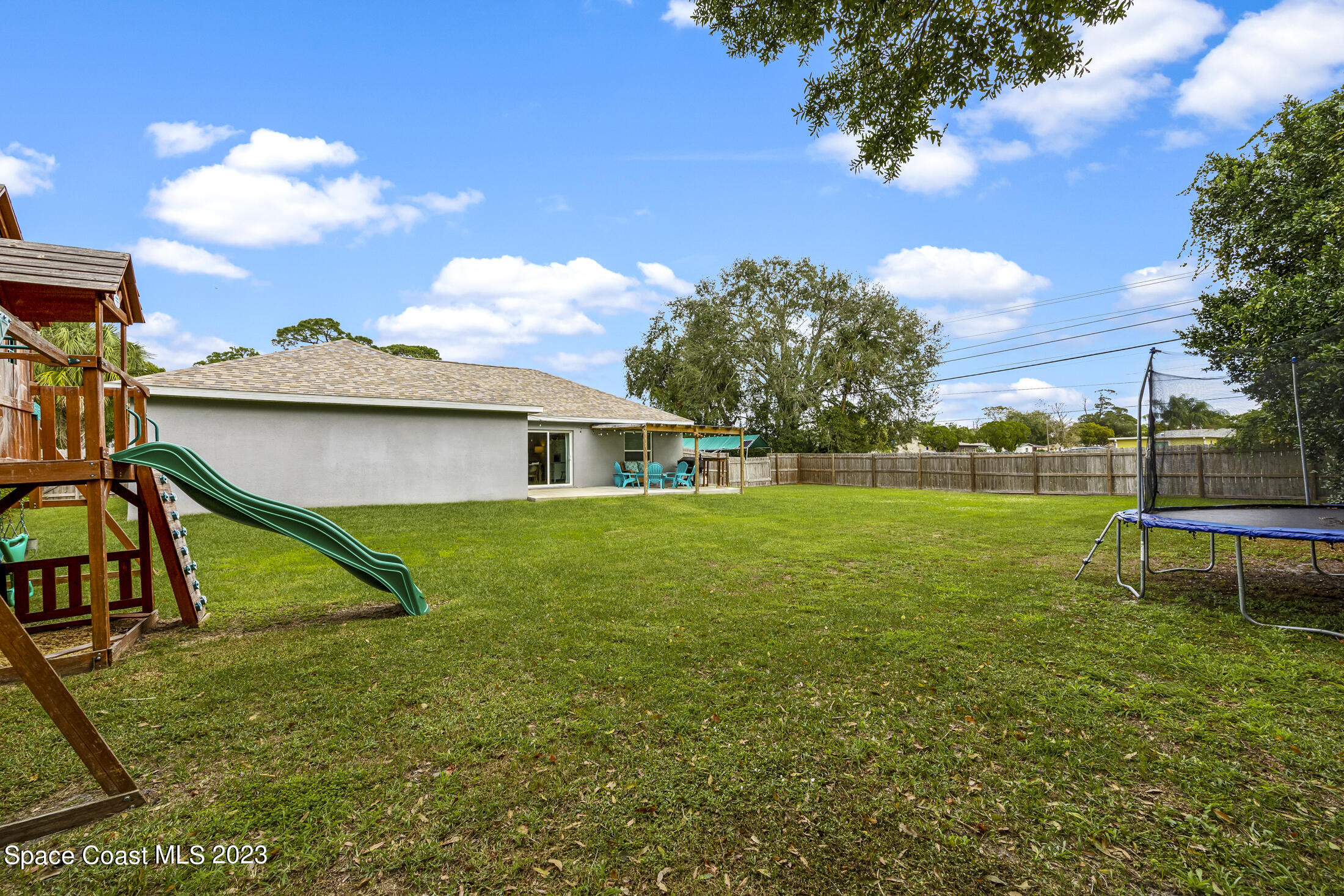 1003 Hayden Road Rockledge, FL 32955 - Photo 28 of 29 a view of a house with a yard