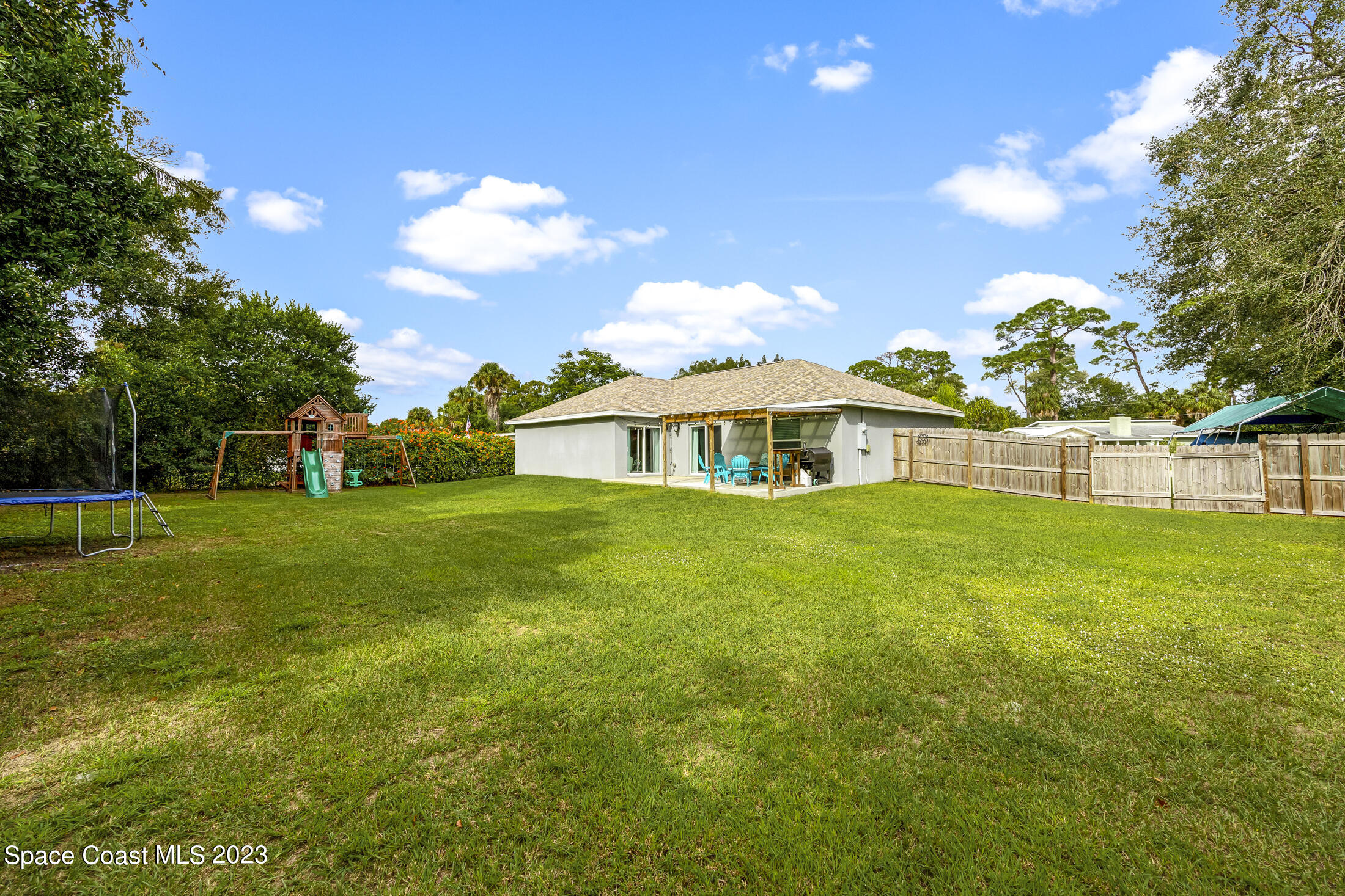 1003 Hayden Road Rockledge, FL 32955 - Photo 5 of 29 a view of an house with backyard and garden