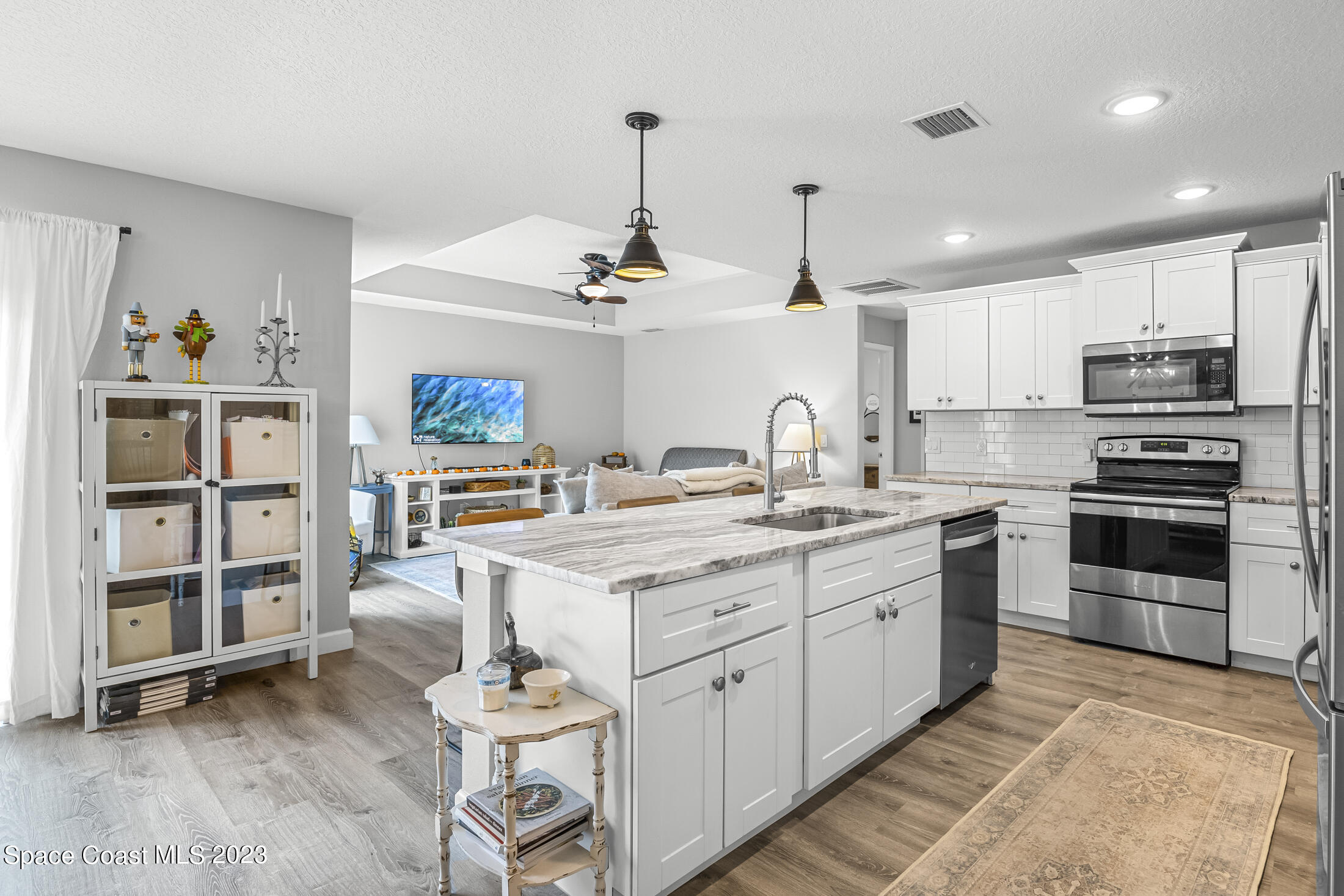 1003 Hayden Road Rockledge, FL 32955 - Photo 6 of 29 a kitchen with a sink cabinets and window