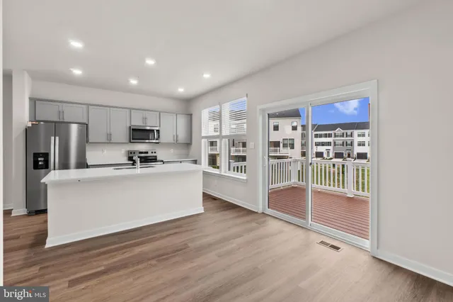 a view of kitchen with stainless steel appliances refrigerator oven