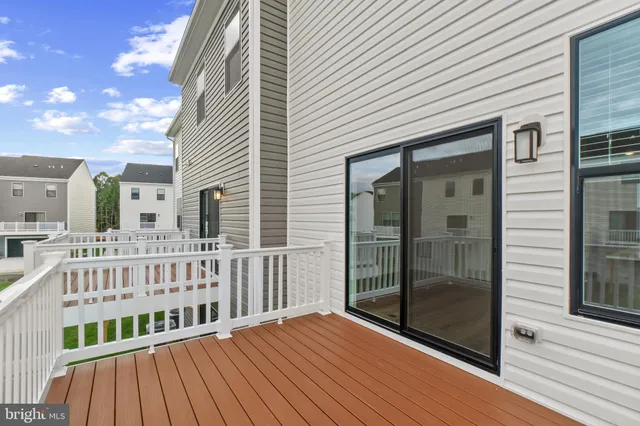 a view of balcony with wooden floor