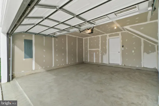 a view of a backyard with table and chairs