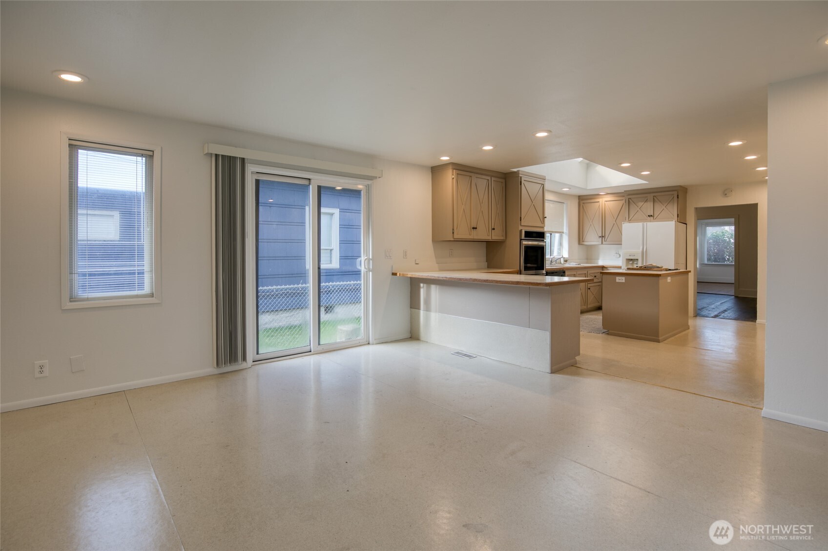 411 West 4th Street Aberdeen, WA 98520 - Photo 14 of 40 a large kitchen with stainless steel appliances granite countertop a large counter top and a stove
