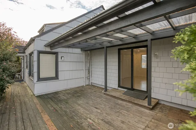 a view of a house with a backyard and garage