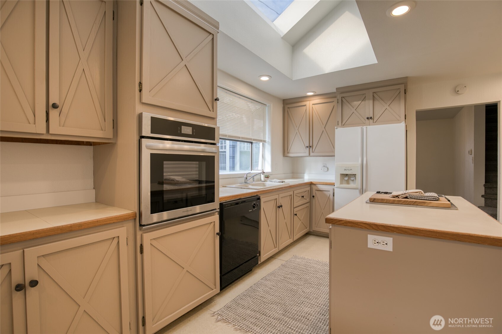 411 West 4th Street Aberdeen, WA 98520 - Photo 10 of 40 a kitchen with stainless steel appliances granite countertop a refrigerator sink and cabinets