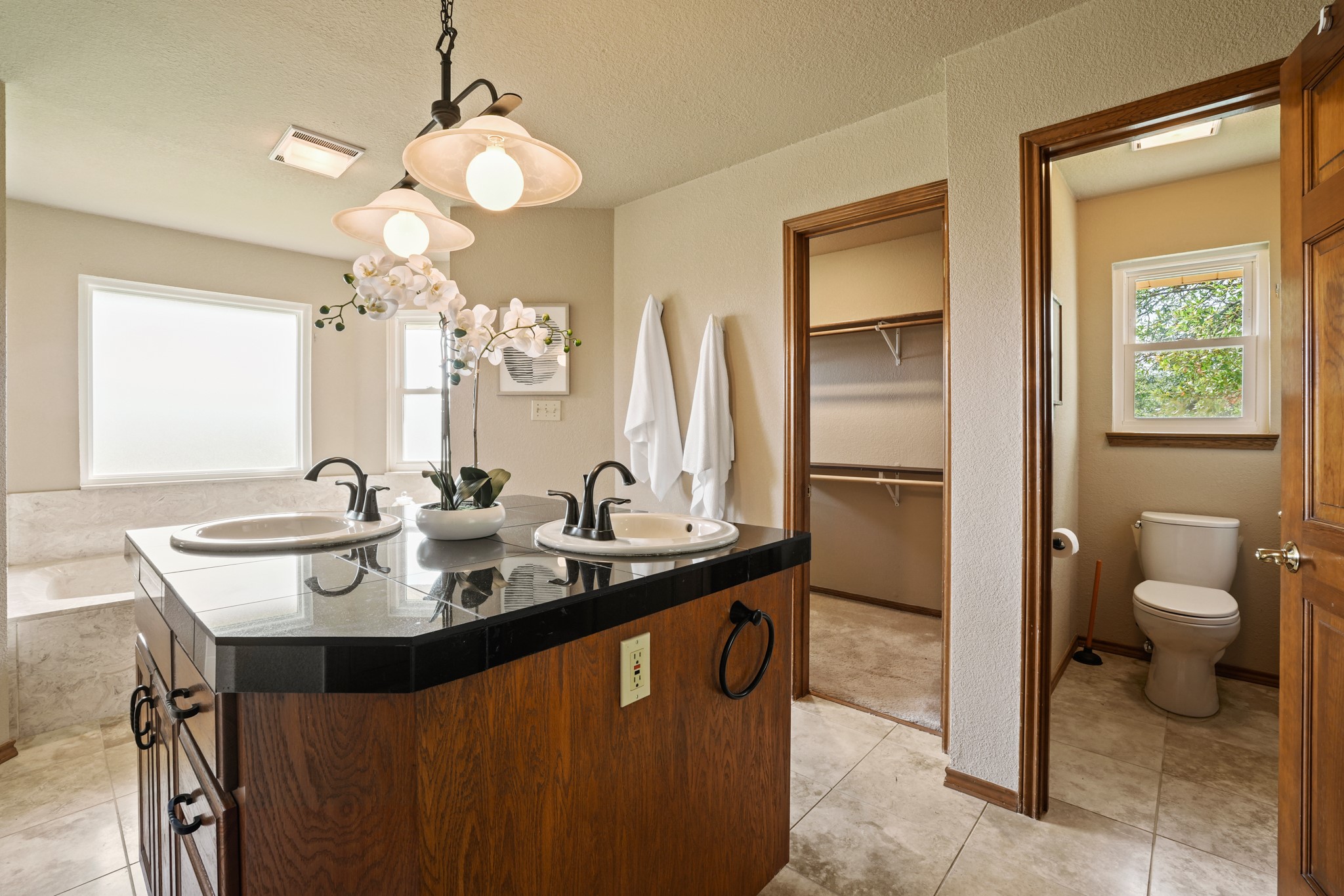 176 Logan Ranch Road Georgetown, TX 78628 - Photo 13 of 38 a bathroom with a sink a toilet and a mirror