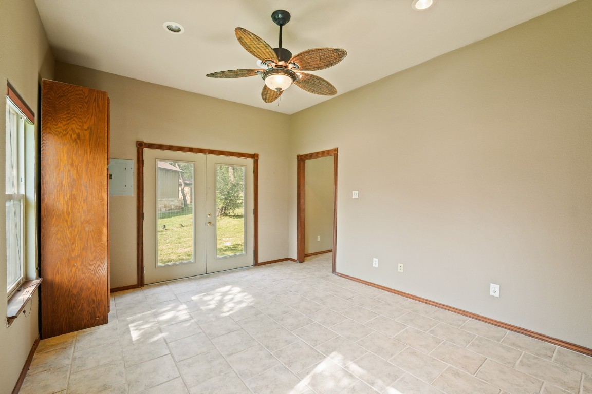176 Logan Ranch Road Georgetown, TX 78628 - Photo 30 of 38 a view of a livingroom with a ceiling fan and a window
