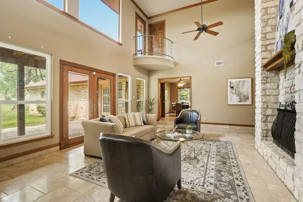 a living room with furniture fireplace and flat screen tv