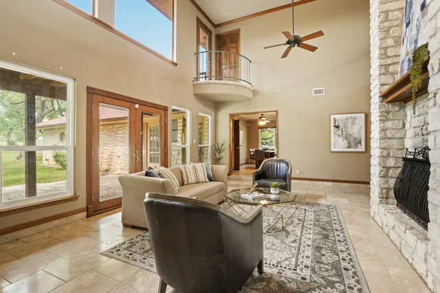 a living room with furniture fireplace and flat screen tv