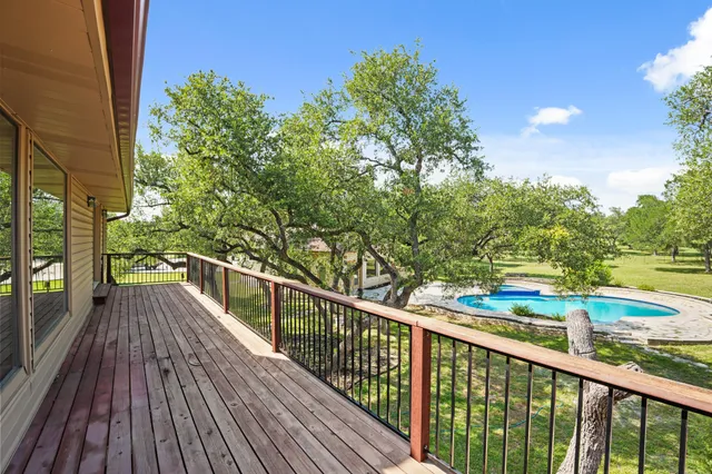 a view of balcony with wooden floor and outdoor space