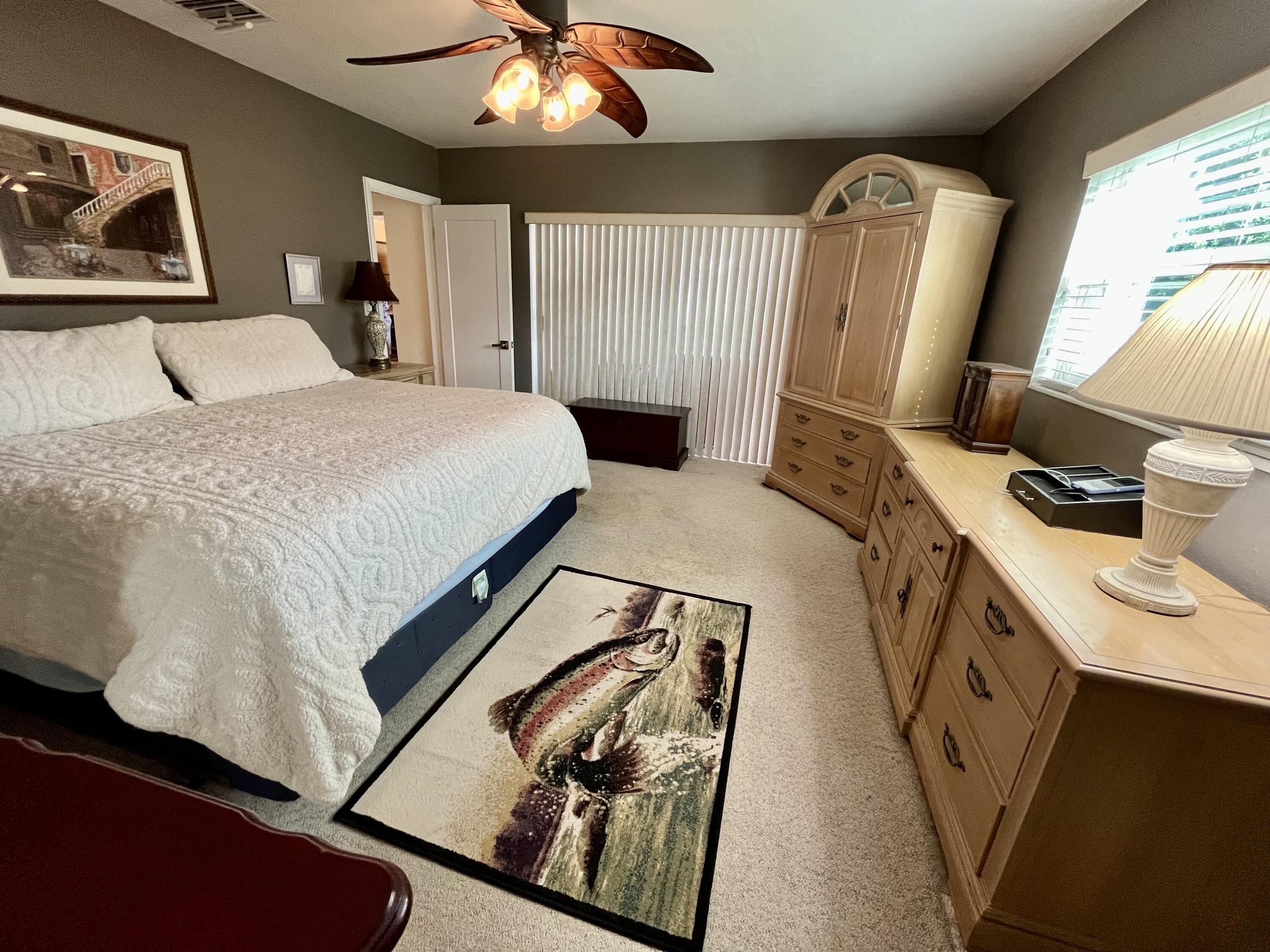 2016 Bonnie Street Boca Raton, FL 33486 - Photo 16 of 28 a bedroom with a bed and a mirror