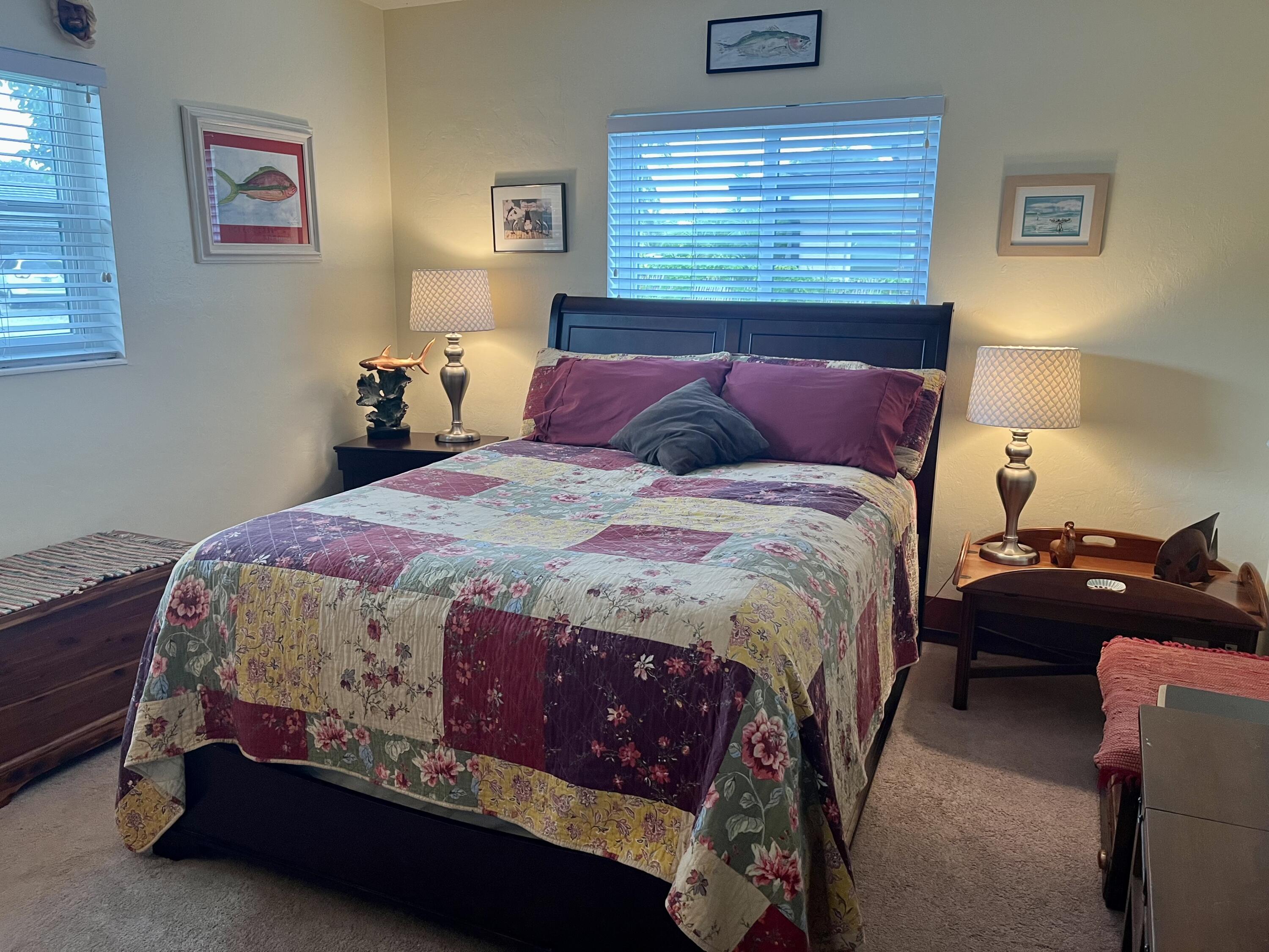 2016 Bonnie Street Boca Raton, FL 33486 - Photo 23 of 28 a bed sitting in a bedroom next to a window