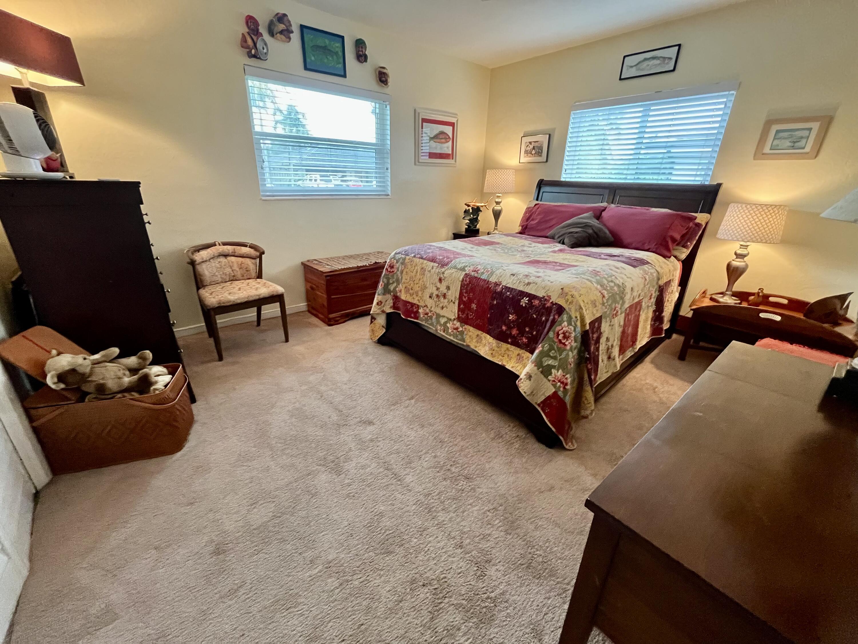 2016 Bonnie Street Boca Raton, FL 33486 - Photo 24 of 28 a bedroom with a bed and a couch