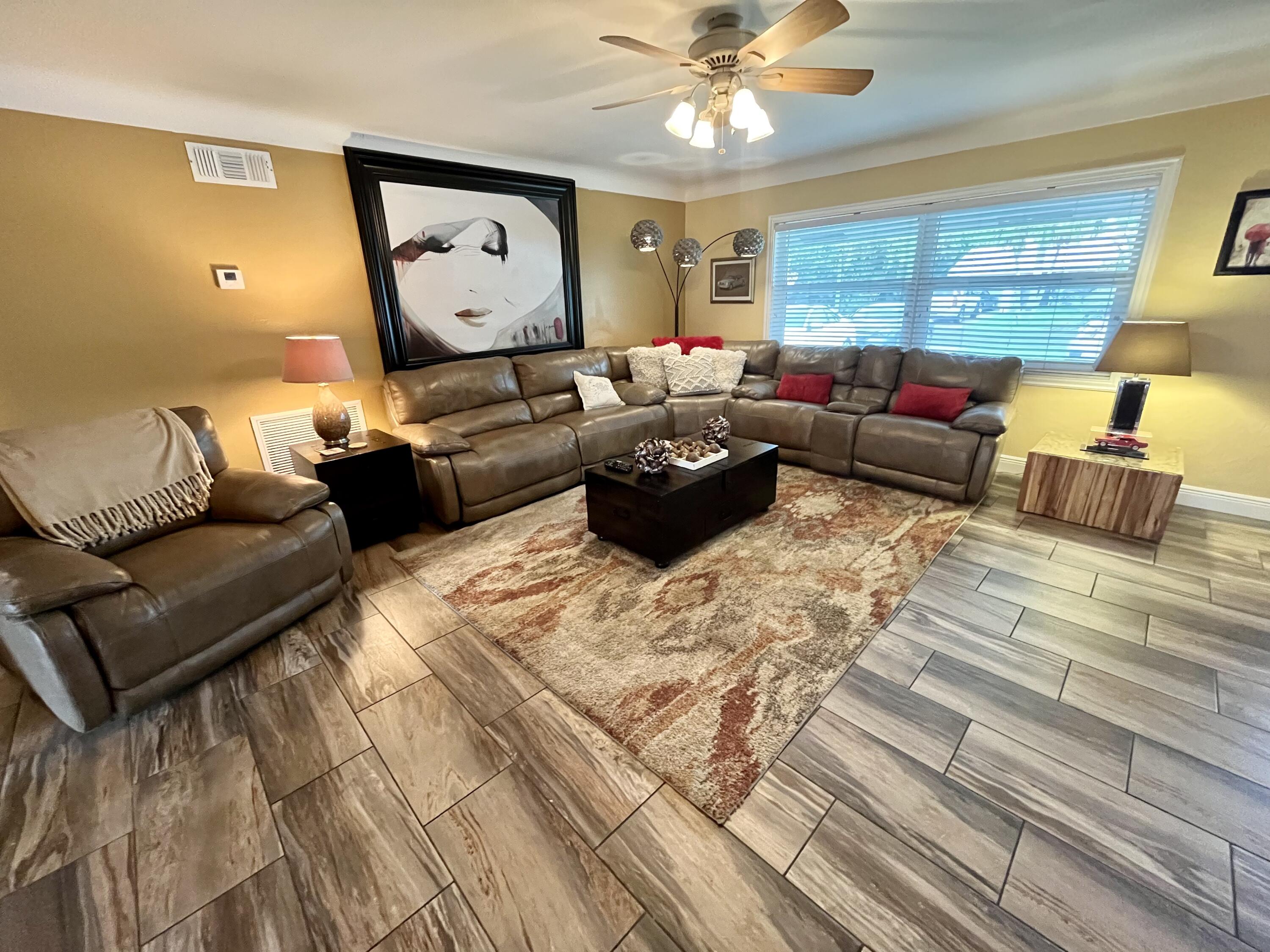 2016 Bonnie Street Boca Raton, FL 33486 - Photo 3 of 28 a living room with furniture and a large window