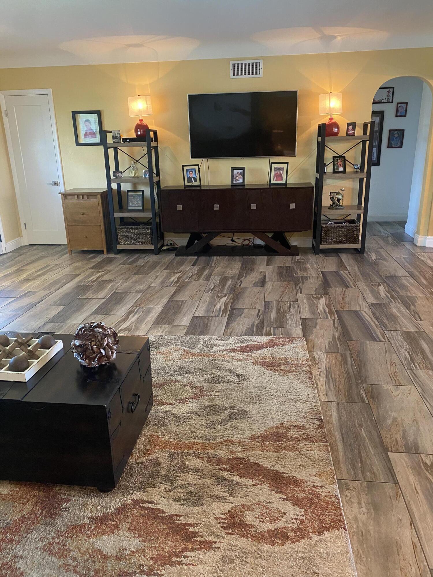 2016 Bonnie Street Boca Raton, FL 33486 - Photo 4 of 28 a living room with furniture and a flat screen tv