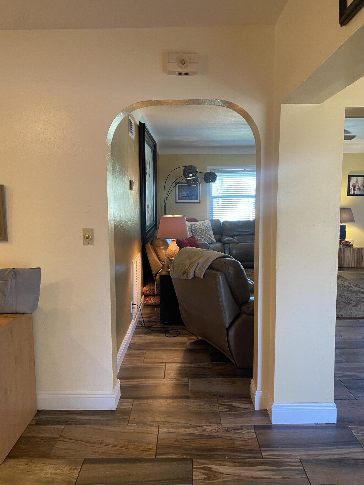 2016 Bonnie Street Boca Raton, FL 33486 - Photo 8 of 28 a bedroom with wooden floor and windows