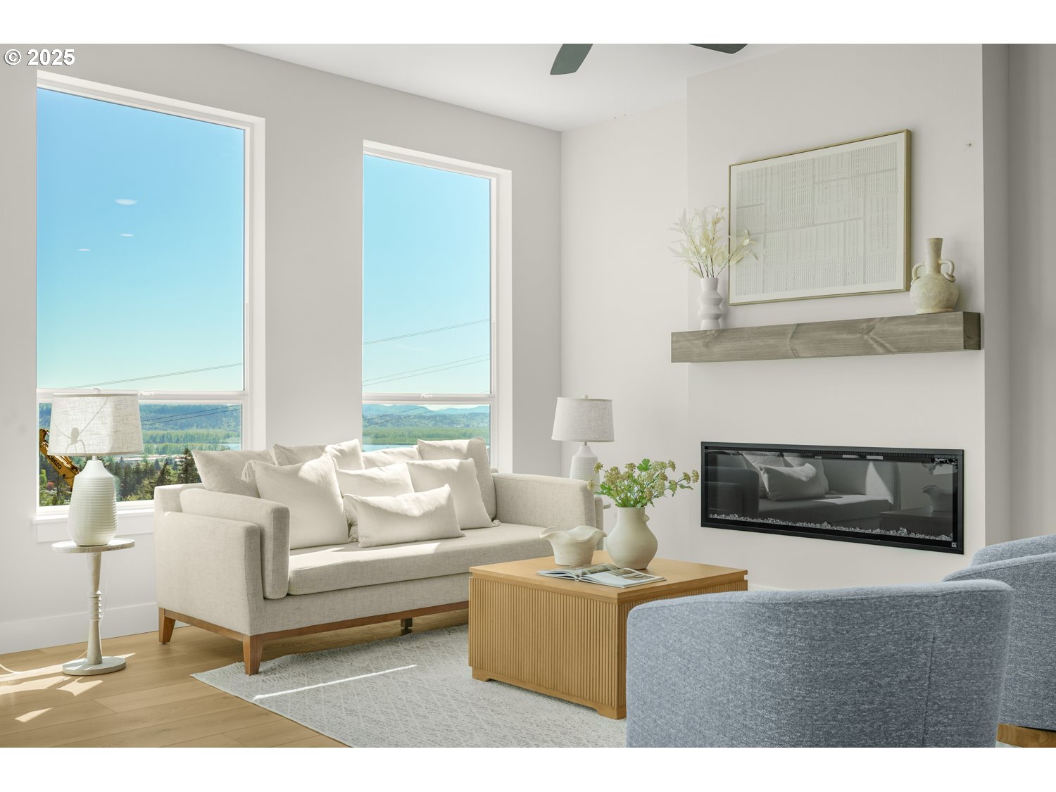 4165 Z Street Washougal, WA 98671 - Photo 17 of 40 a living room with furniture a fireplace and a large mirror