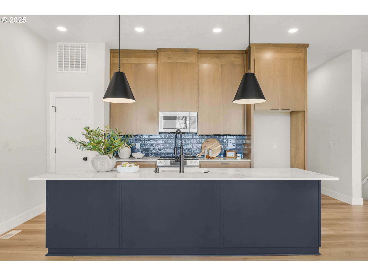 4165 Z Street Washougal, WA 98671 - Photo 6 of 40 a kitchen with kitchen island granite countertop a sink a stove and cabinets