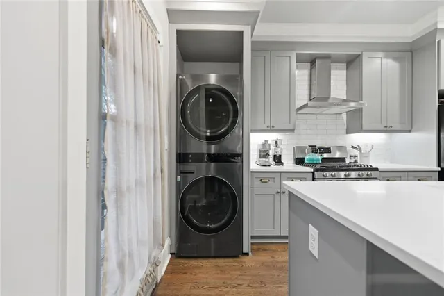 a kitchen with a washer and dryer in it