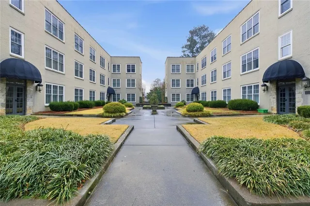 a view of building with yard