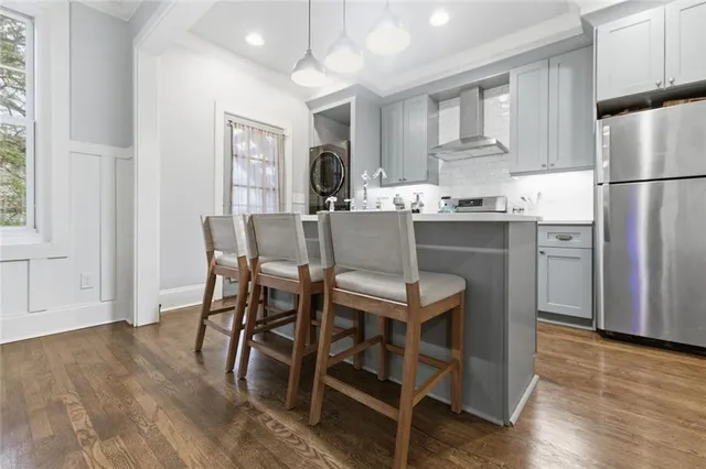 a view of a dining room with furniture and wooden floor