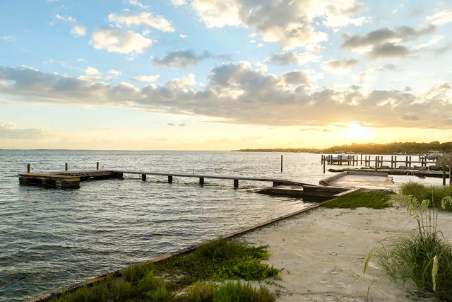 a backyard of a house with outdoor seating