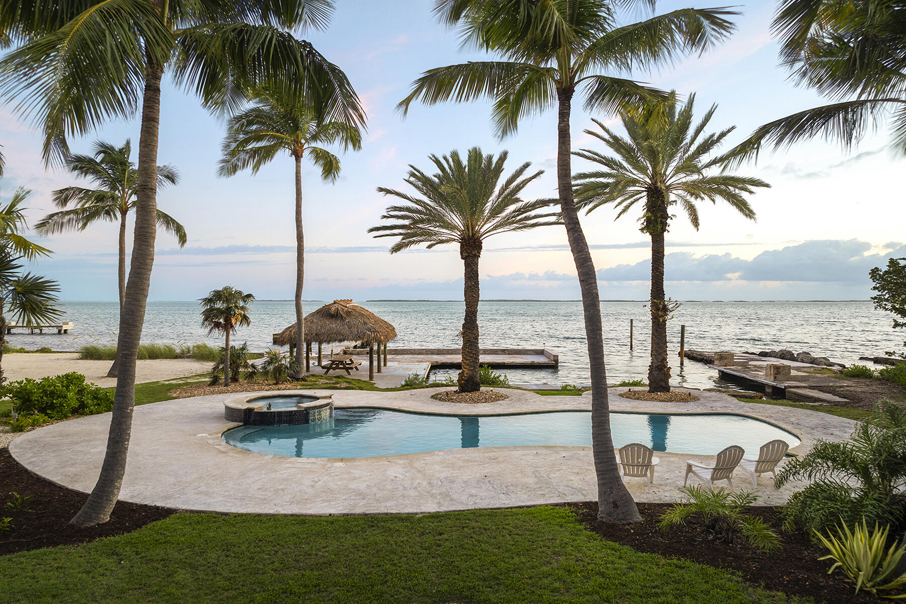 36 Sunset Road Key Largo, FL 33037 - Photo 17 of 25 a view of swimming pool with table and chairs