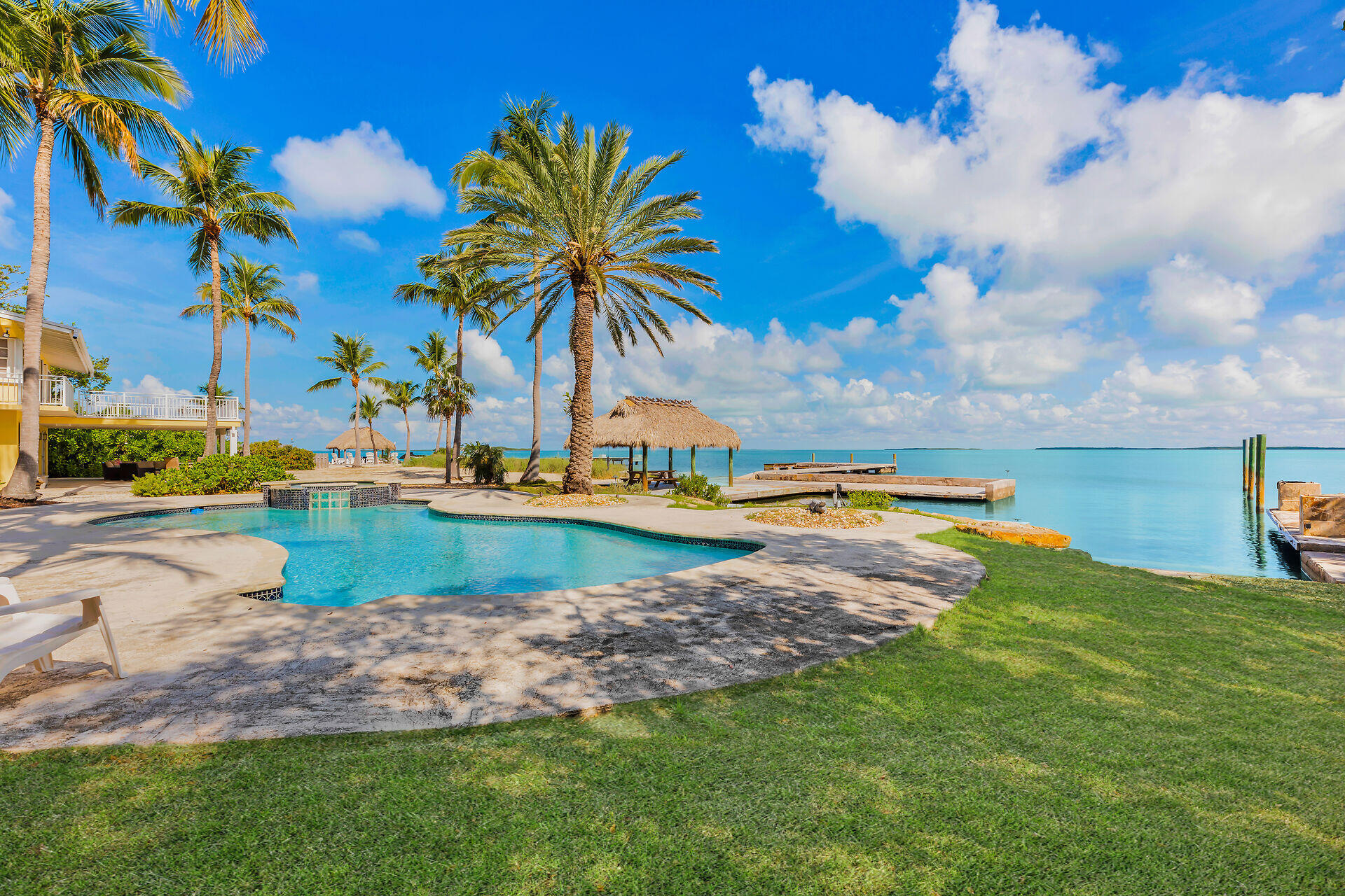36 Sunset Road Key Largo, FL 33037 - Photo 21 of 25 a view of a swimming pool and lake view