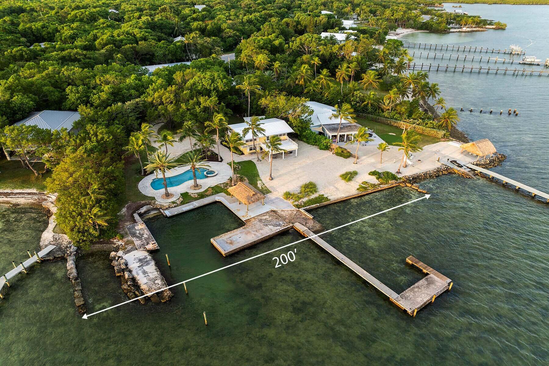 36 Sunset Road Key Largo, FL 33037 - Photo 5 of 25 an aerial view of a house with a yard