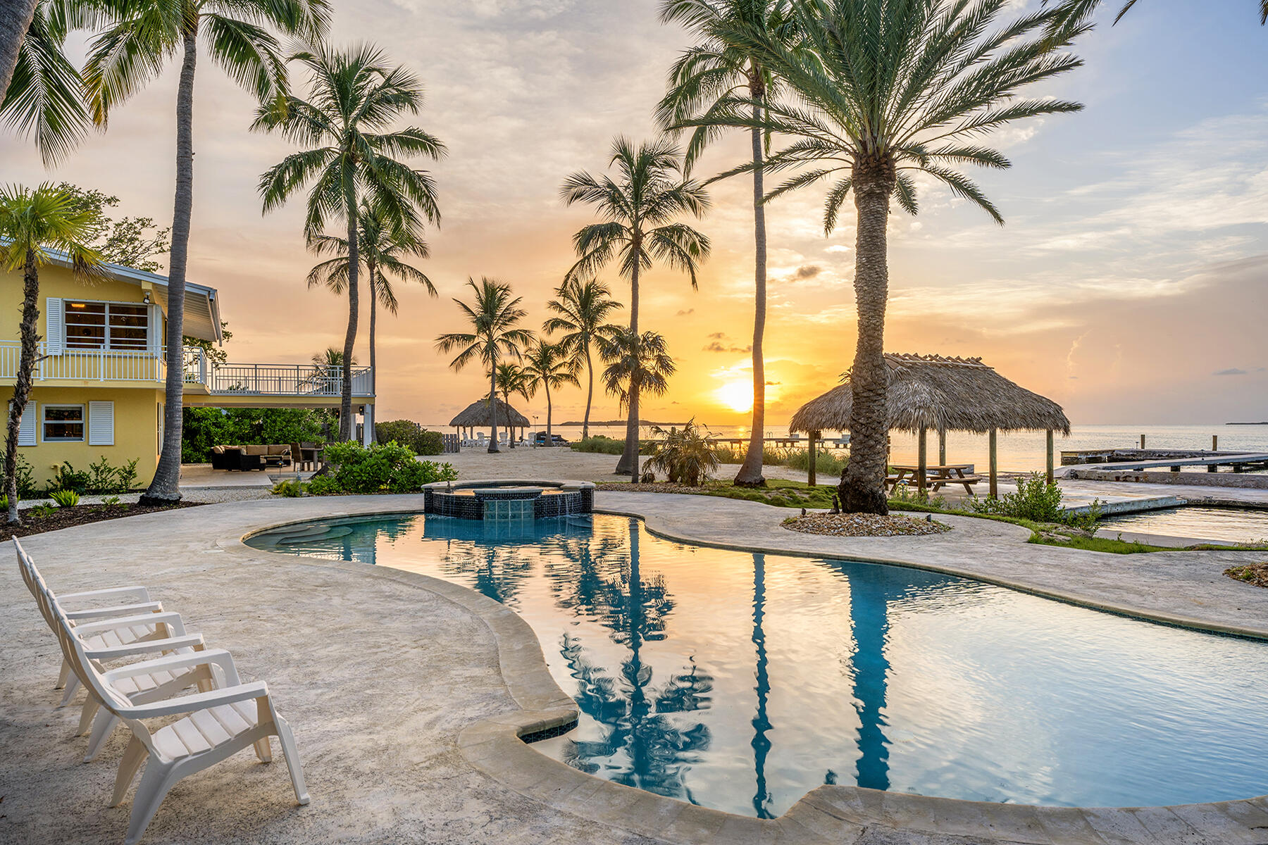 36 Sunset Road Key Largo, FL 33037 - Photo 8 of 25 a view of swimming pool with a table and chairs