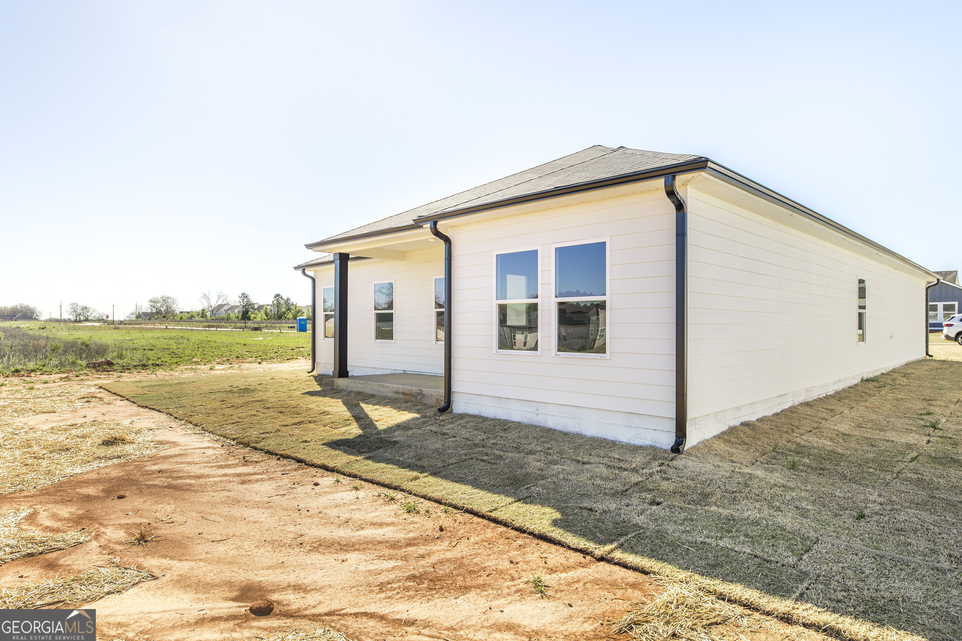 508 Georgian Walk Byron, GA 31008 - Photo 26 of 27 a view of a house with backyard and trees
