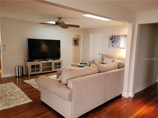 a view of a dining room with furniture and window