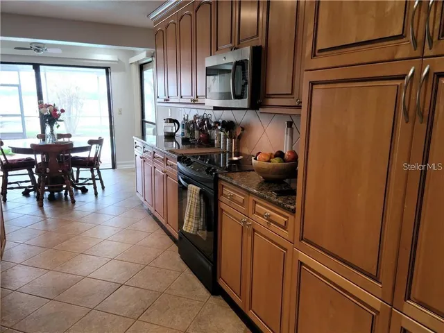 a view of a dining room with furniture and window