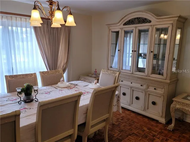 a view of a dining room with furniture window and outside view