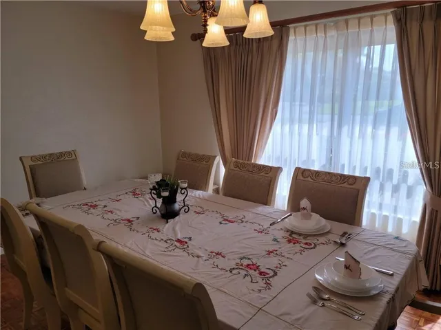 a living room with a large window and table