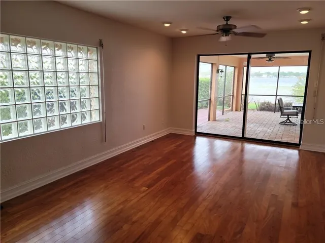 a living room with furniture and next to a window