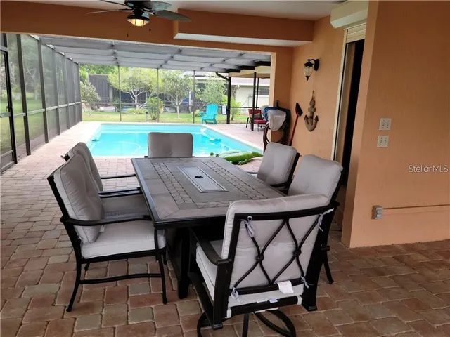 a view of a dining room with furniture window and outside view