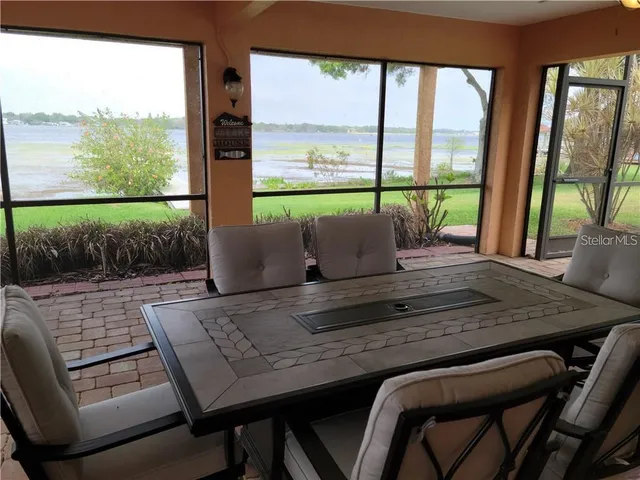 a bedroom with a bed and a potted plant