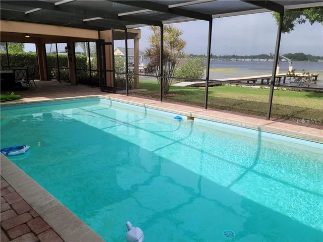 a view of swimming pool with a yard