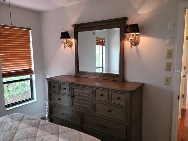 a bathroom with a sink toilet and a mirror