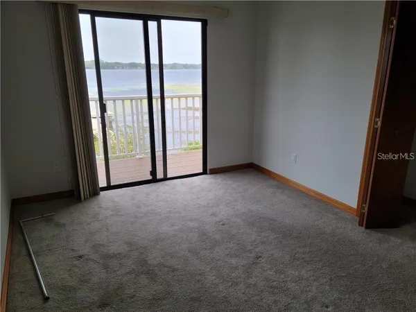 a view of a swimming pool with outdoor seating