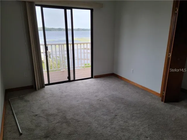 a view of a swimming pool with outdoor seating