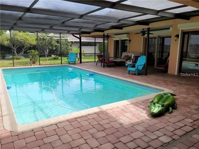 a living room with furniture fireplace and a window