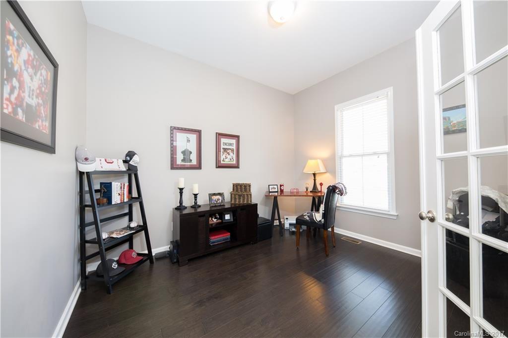 607 Caspar Way Fort Mill, SC 29708 - Photo 11 of 24 a bedroom with furniture and a wooden floor
