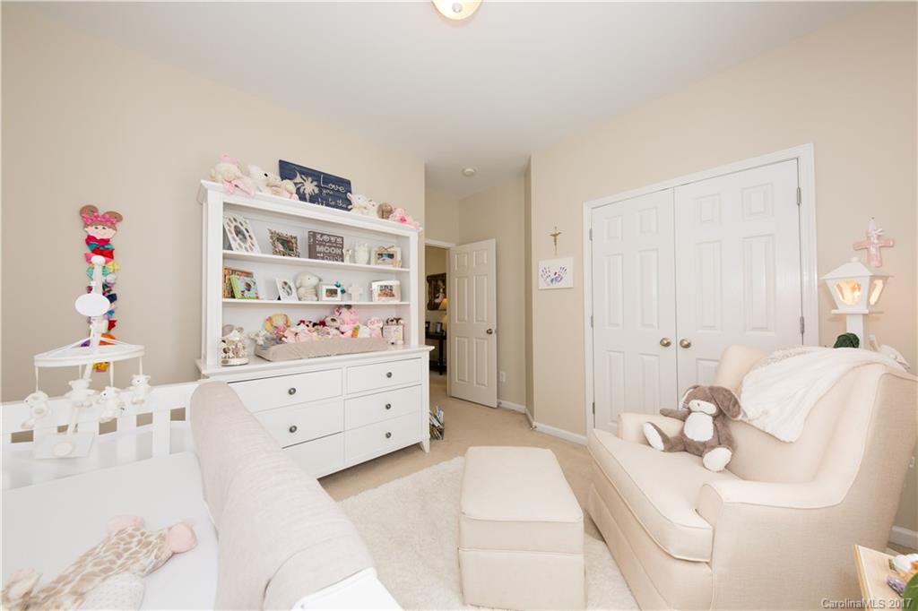 607 Caspar Way Fort Mill, SC 29708 - Photo 13 of 24 a bedroom with a bed and a cabinets